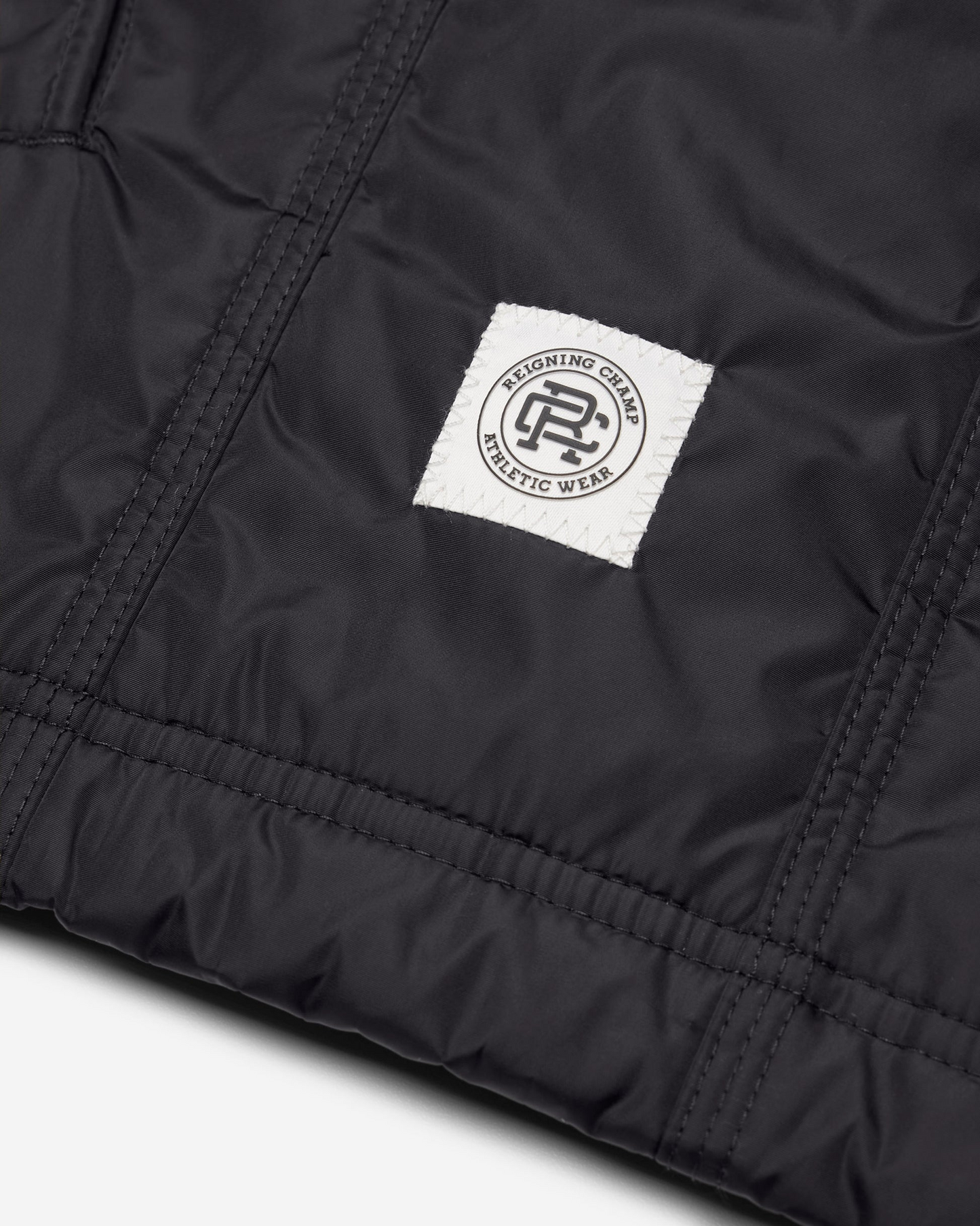 REIGNING CHAMP - ECONYL SATIN NYLON COACH'S JACKET